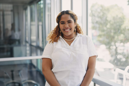 A woman smiling in an office