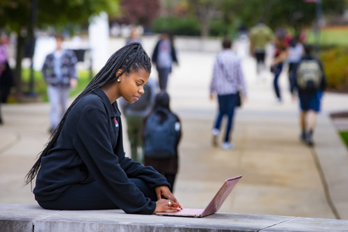 A woman working on a laptop